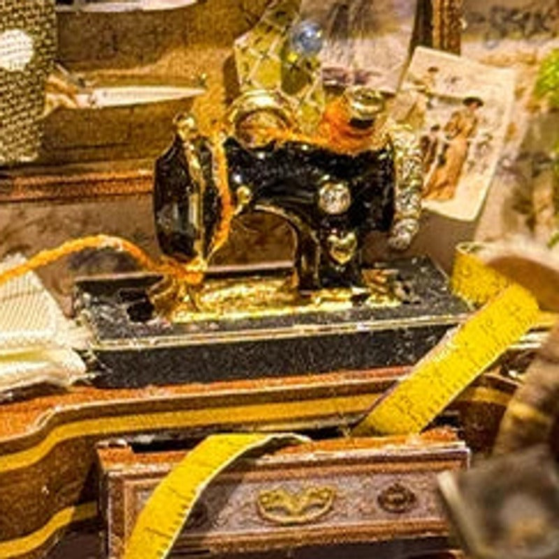 A tiny sewing machine, ready to work