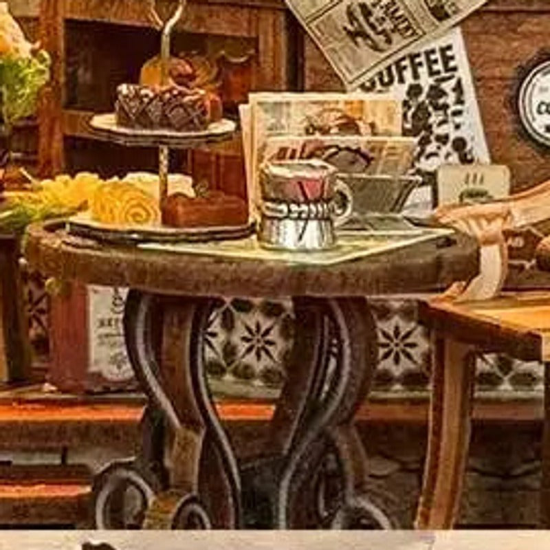 Coffee and little desserts waiting on the café table.