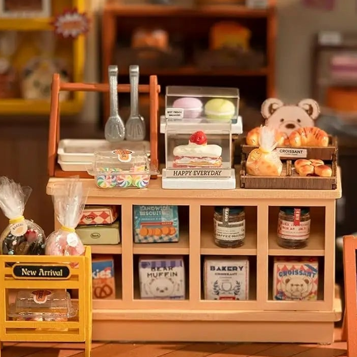Tiny jars and packages fill eight cubbies beneath the treats.