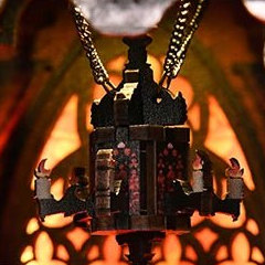 A little chandelier suspended on chains