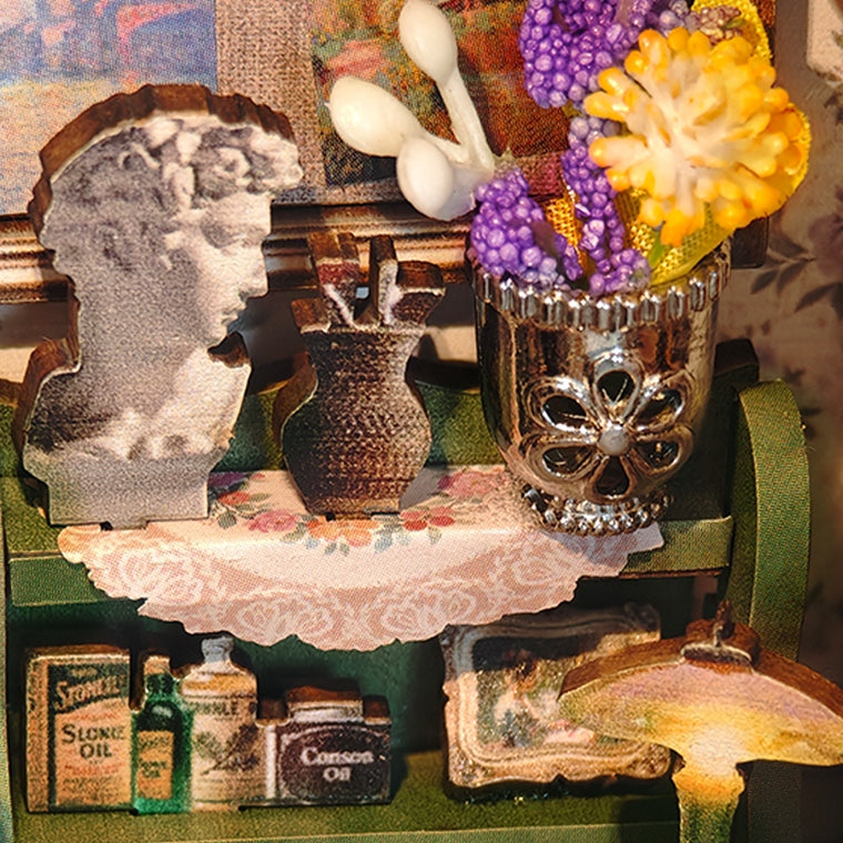 Flowers and a tiny bust on the workbench
