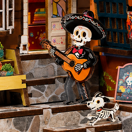 A tiny guitarist on the steps