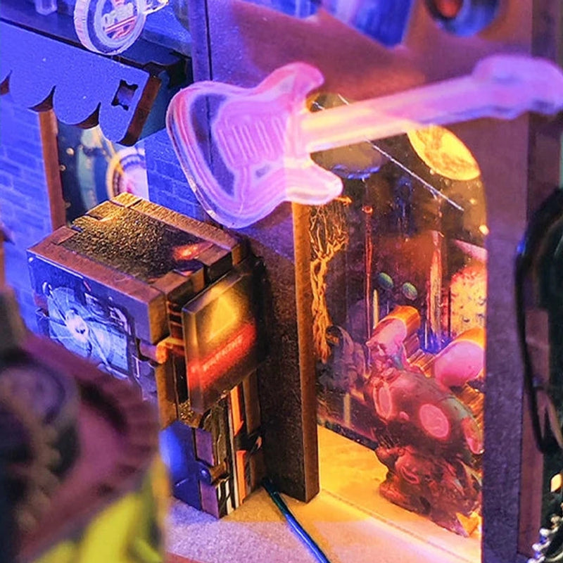 A pink guitar sign marks a doorway on the miniature street.