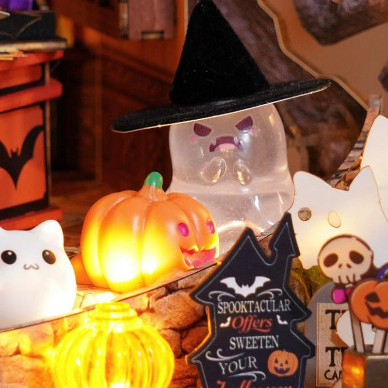 A pumpkin lantern lights the ghostly gathering