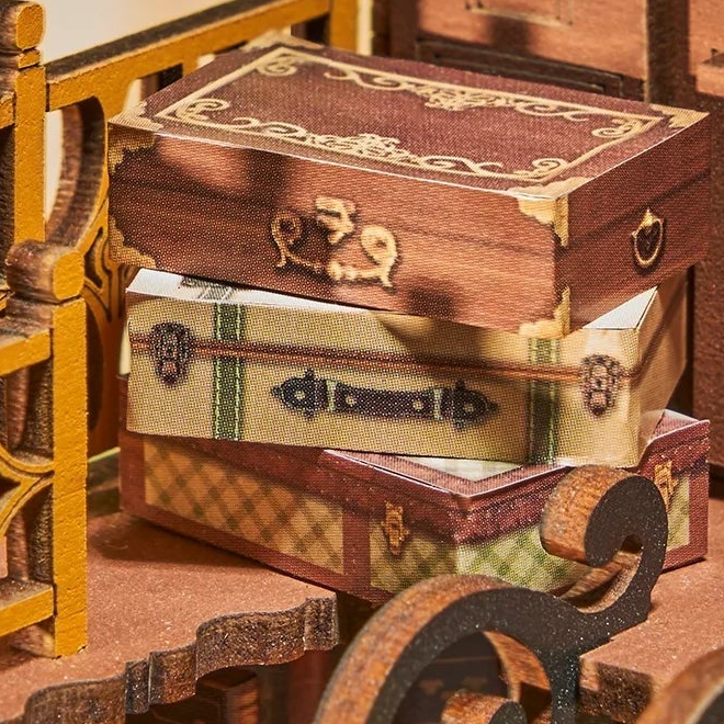 Little suitcases above the books