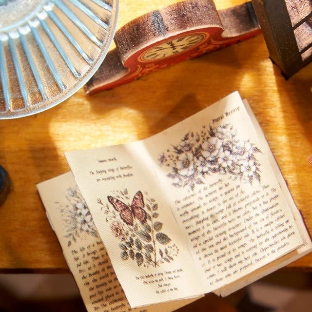 An open book waiting on the desk