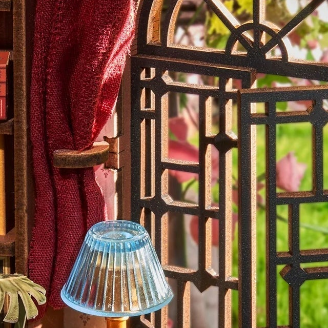 An arched window and deep red curtain