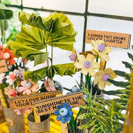 Little flowers with cheerful garden signs