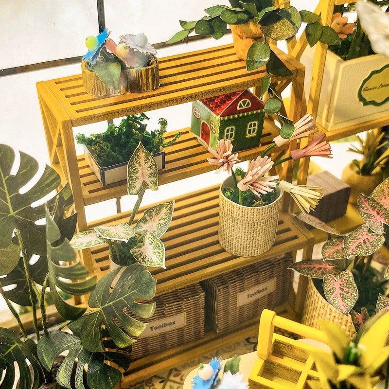 Plants layered on sunny yellow shelves