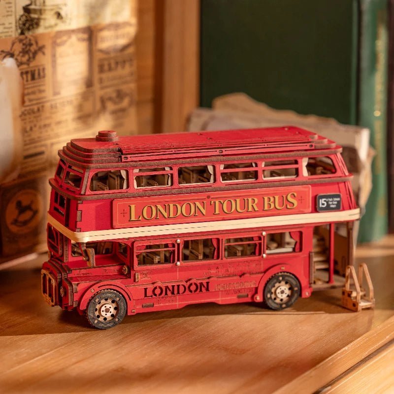 Original side view of the red London Tour Bus model with open windows and wooden passenger seats
