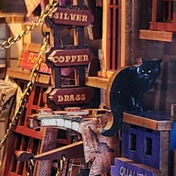 A black cat above the shop signs