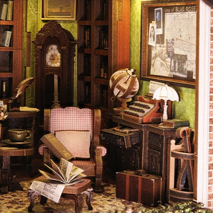 A checked armchair beside the clock and typewriter