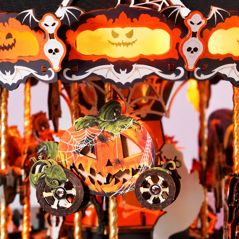 A pumpkin carriage beneath glowing jack-o’-lantern faces.