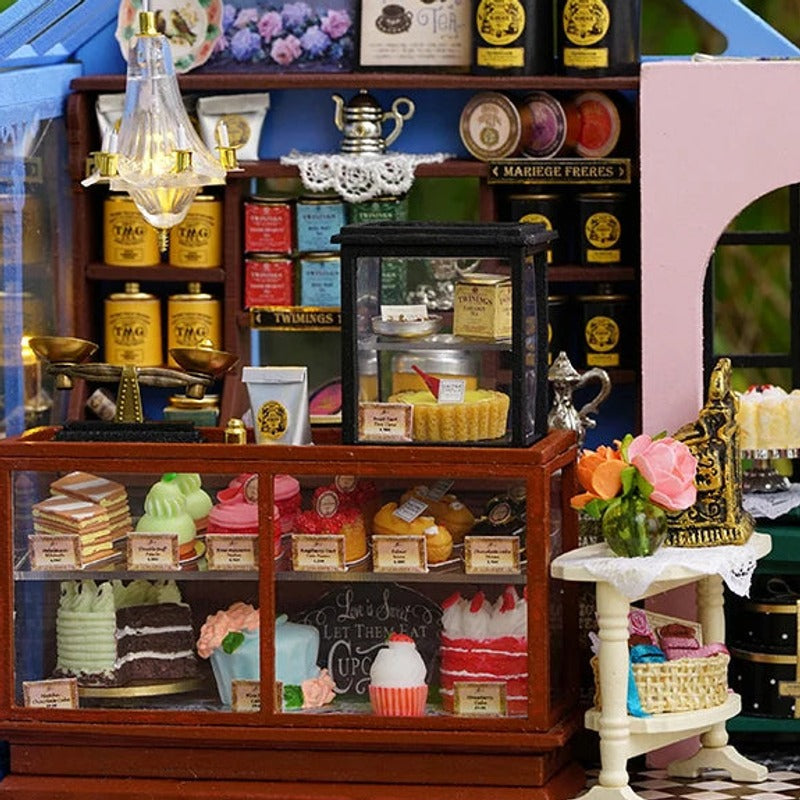 Tea tins and miniature cakes, ready at the counter
