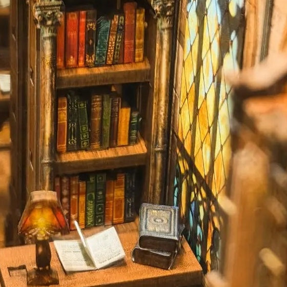 A reading desk beside patterned glass