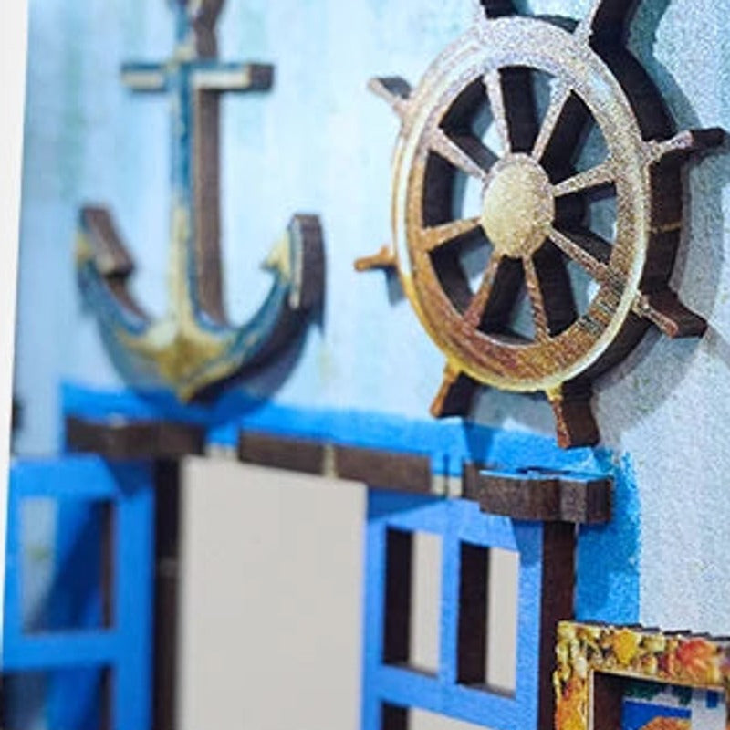 A little anchor and ship's wheel decorate the wall.