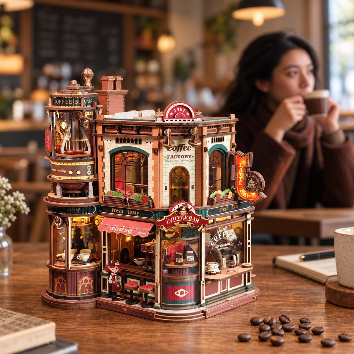 Coffee Factory — enjoying a coffee beside the completed miniature (AI-assisted lifestyle visualization).