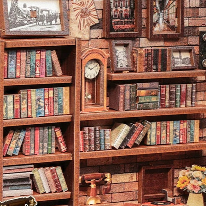 Books, framed art and a tiny clock