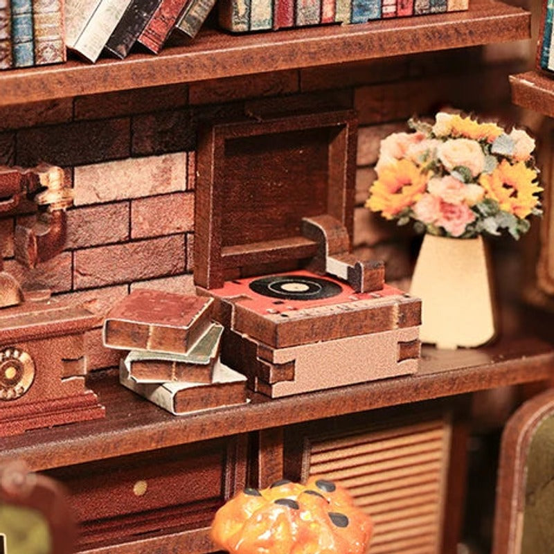 A little record player beneath the books