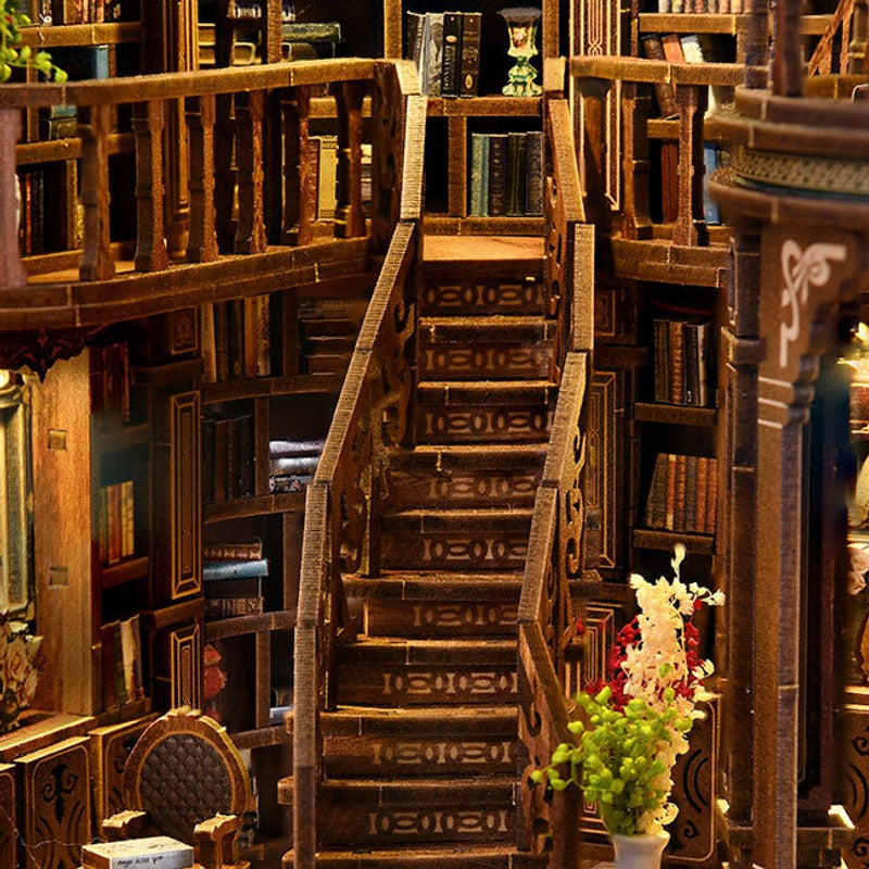 A winding staircase between rows of tiny books.