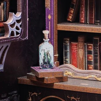 A little bottle beside the waiting books