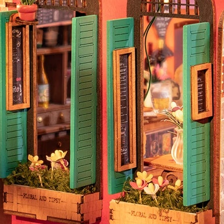 Green shutters and flower boxes