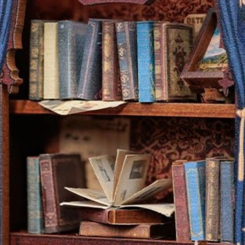 Books behind blue curtains