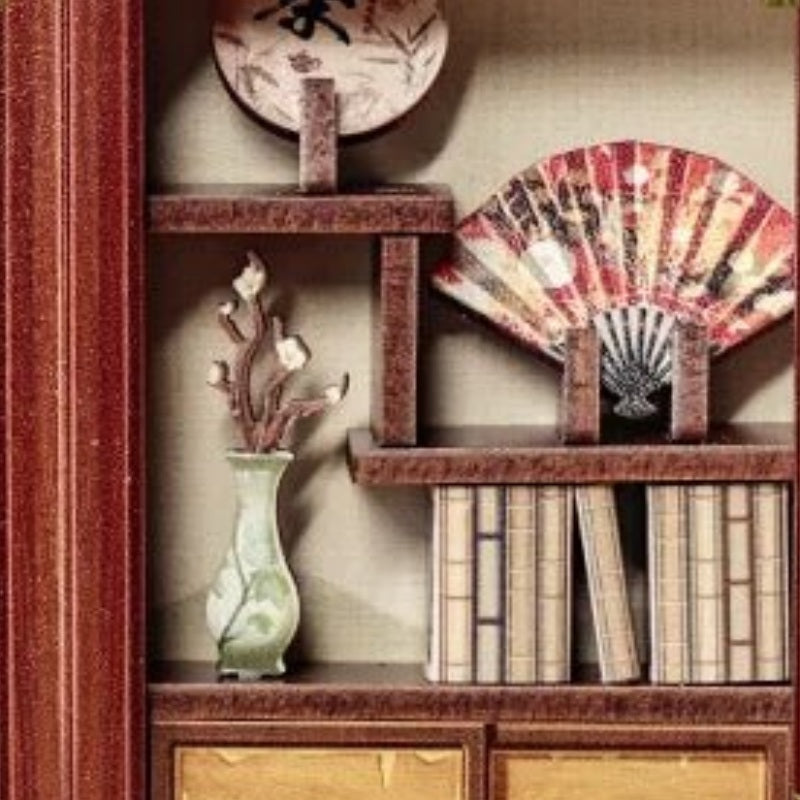 A fan on the bookshelf
