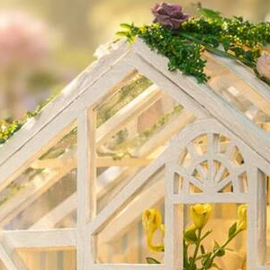 Flowers around a tiny arched window