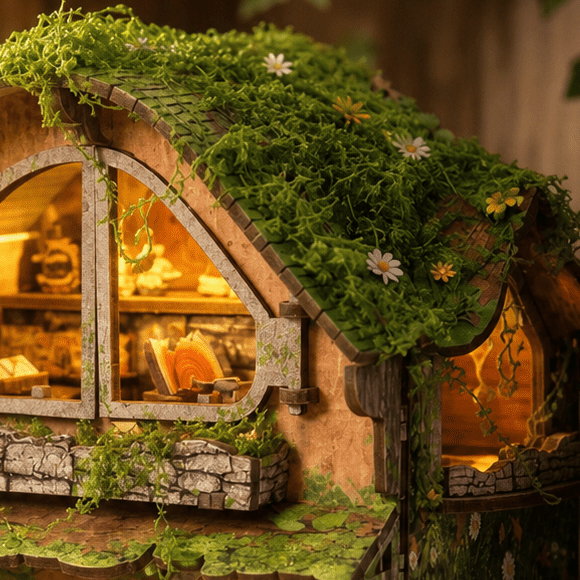 Woodland greenery follows the curve of the roof.