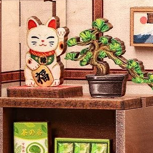 A lucky cat and a little pine