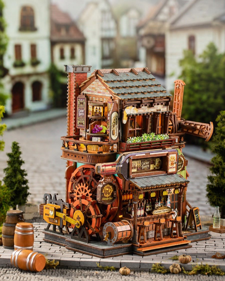 Corner Tavern mechanical model kit with its exposed gear mechanism in a village scene
