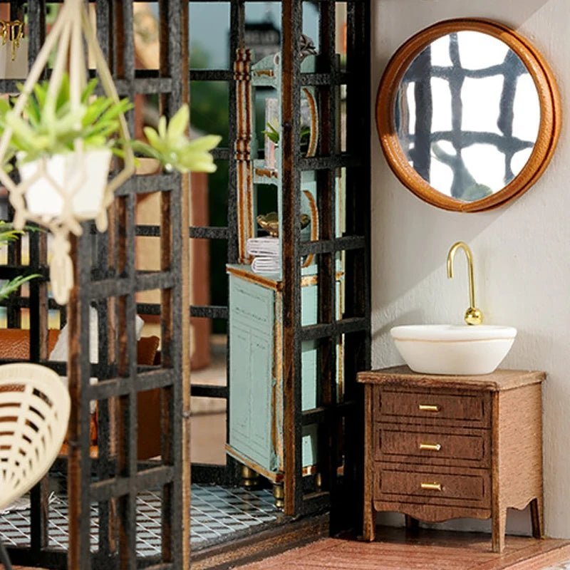 A bowl-shaped basin and curved tap beneath a round mirror.