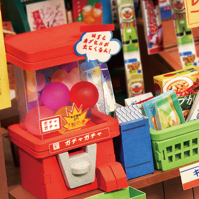 A red capsule machine beside the snack baskets