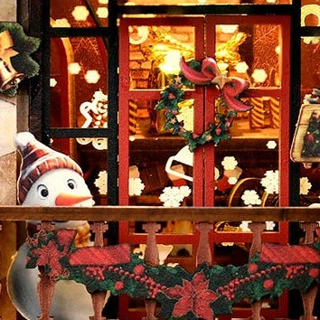 A snowman and holly garland dress the upper shop balcony.