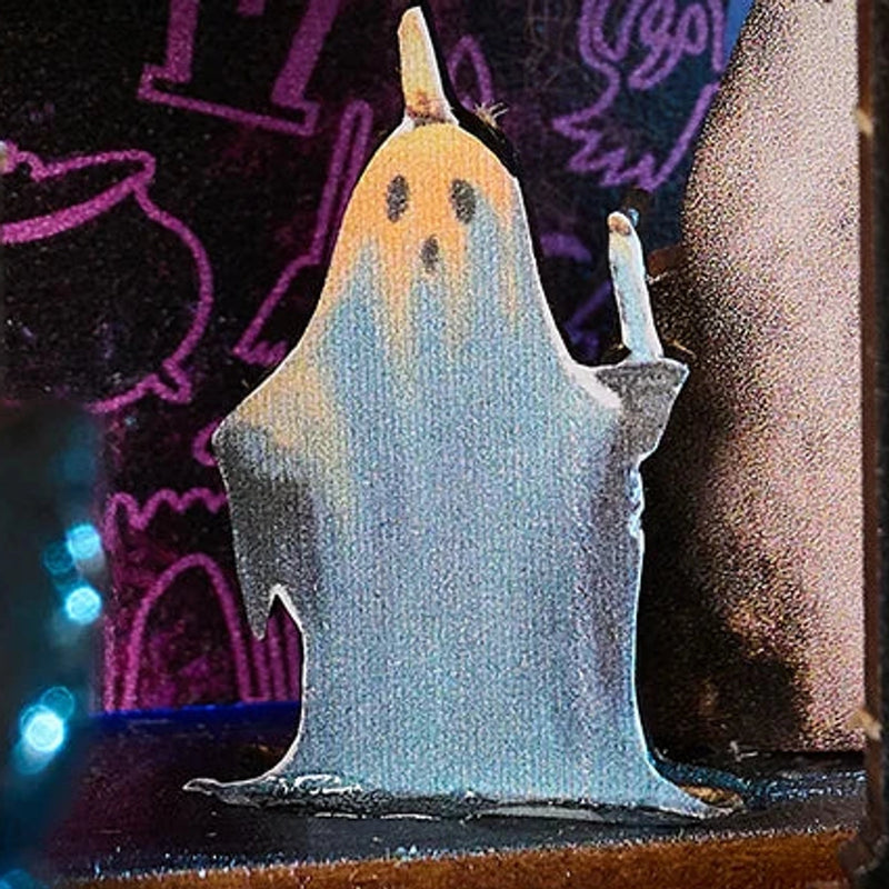 Even the little ghost brings a candle to the party.