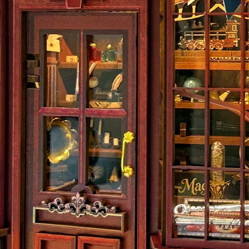 A tiny gold handle invites a closer look through the shop door.
