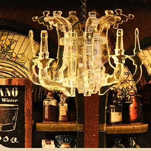 A clear miniature chandelier hangs over the café interior.
