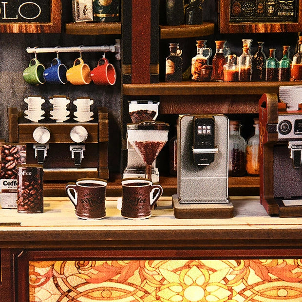 Colourful mugs hang above miniature coffee machines and bottles.