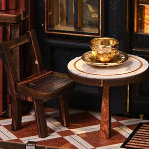 A golden cup waits on the little round table outside.