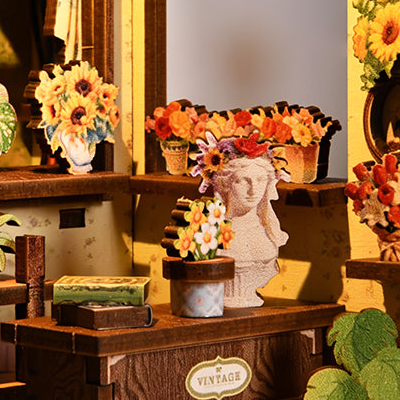 A portrait planter decoration on the florist’s worktable