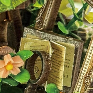 An open book beneath a tiny lens