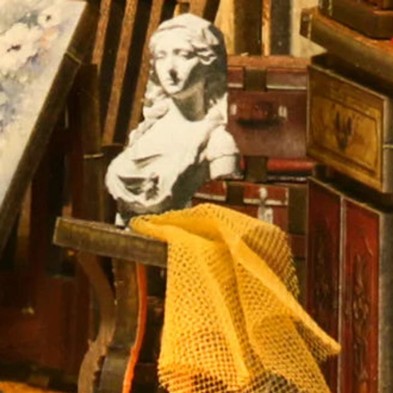 A sculpted bust beside the painter’s workspace