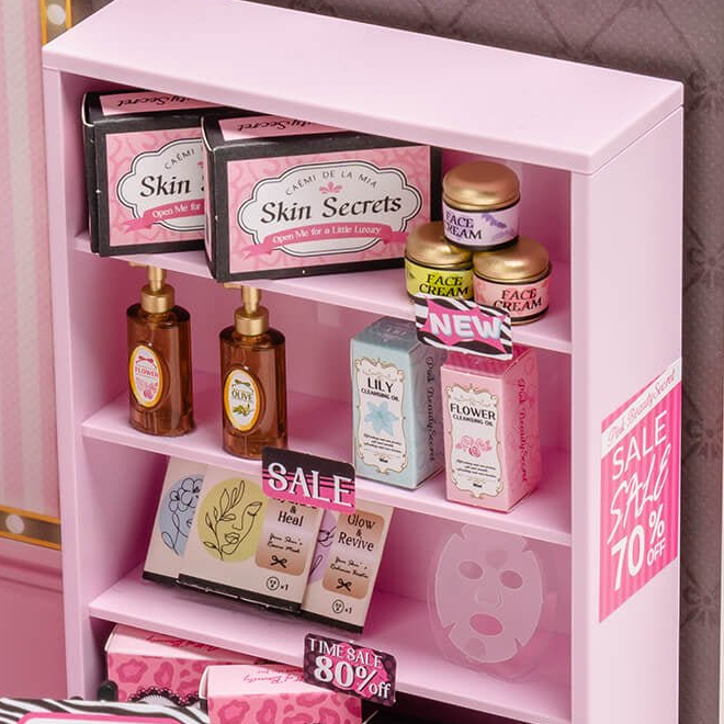 Skincare boxes and bottles on pink shelves