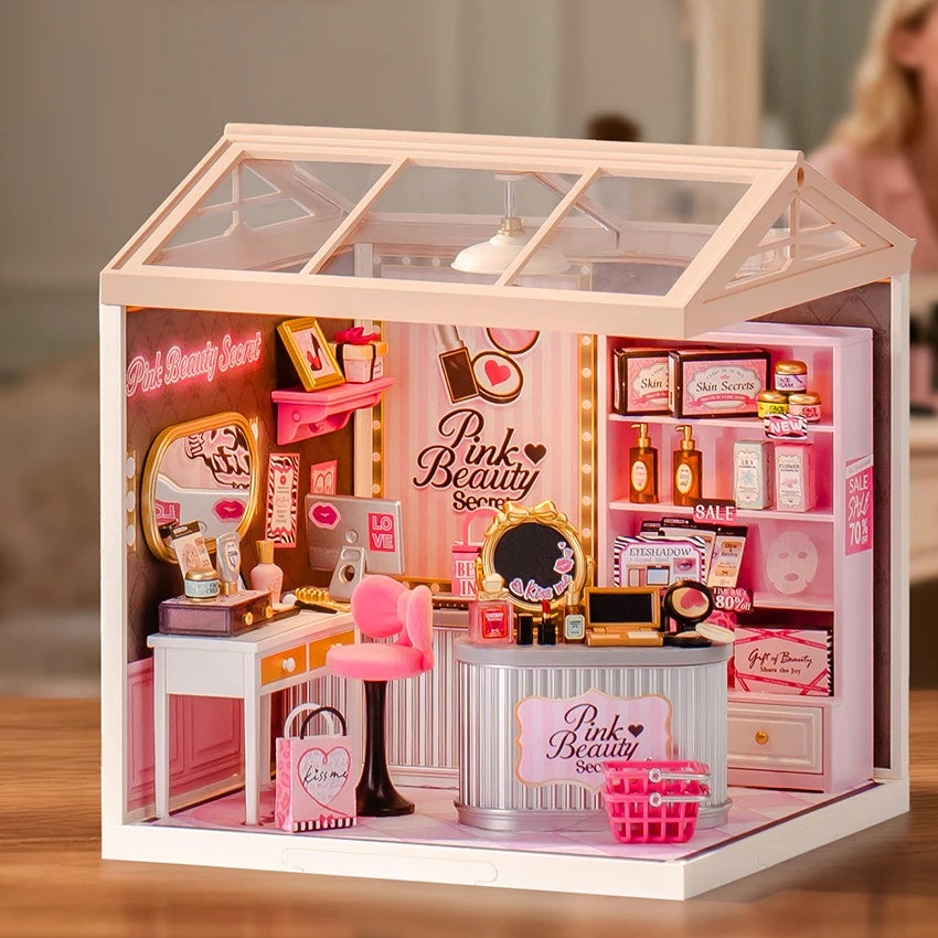 Complete Pink Beauty Secret miniature beauty shop on a wooden dressing table