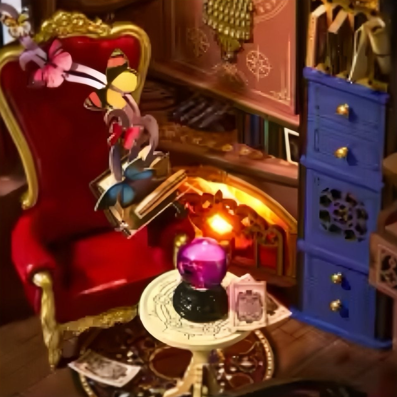 A purple crystal ball and a book of butterflies