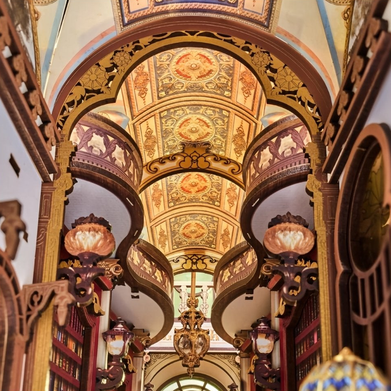 A patterned vault above curved balconies