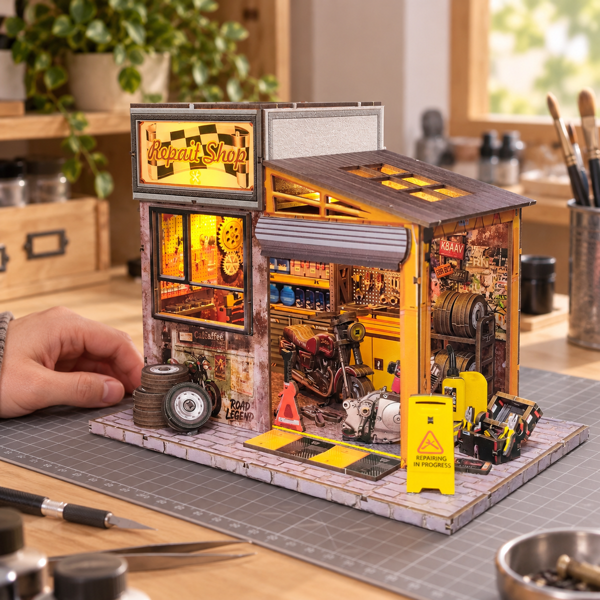 Motorcycle Repair Shop miniature kit on a home craft table