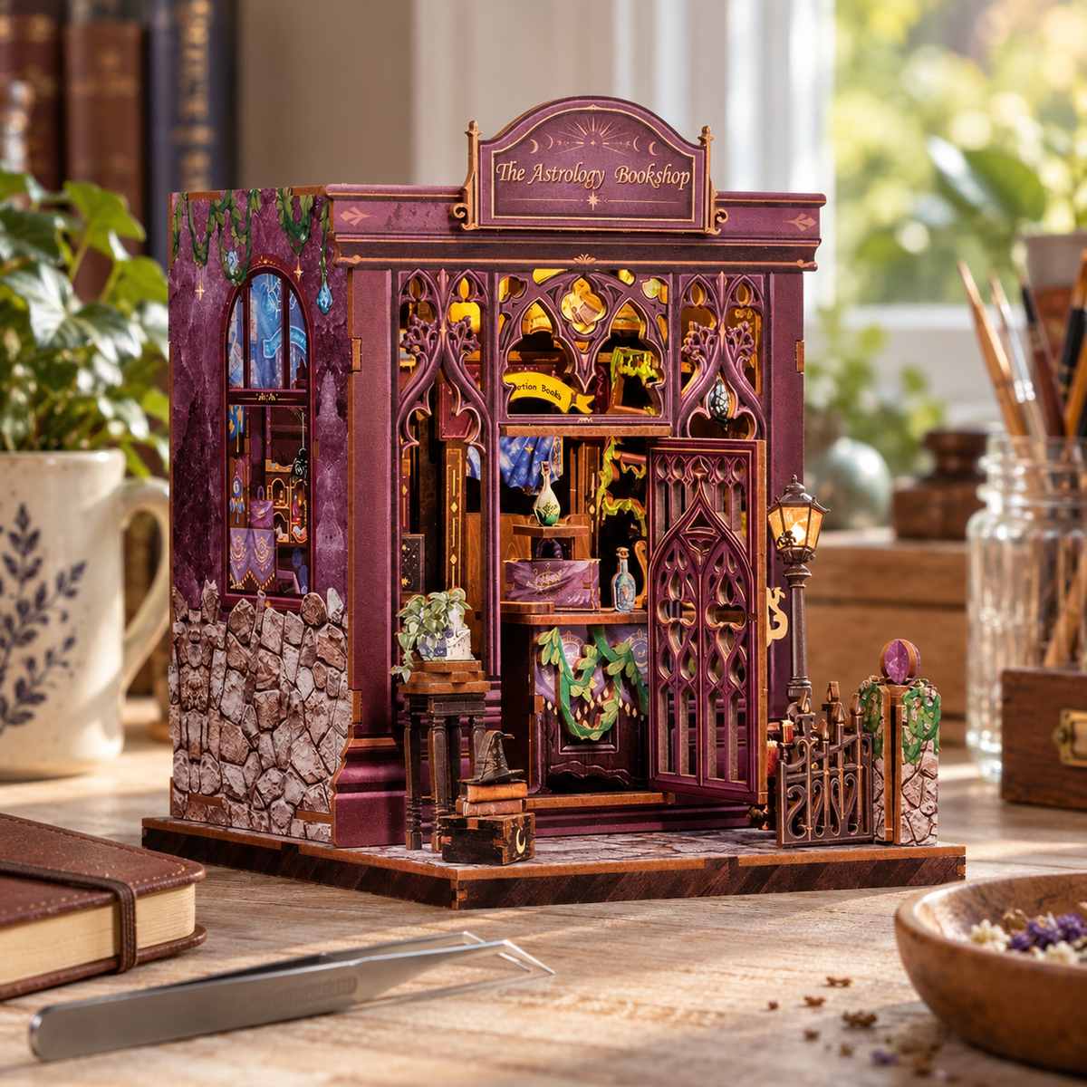 The Astrology Bookshop miniature kit on a home craft table