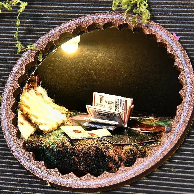 A reading nook in an oval window.